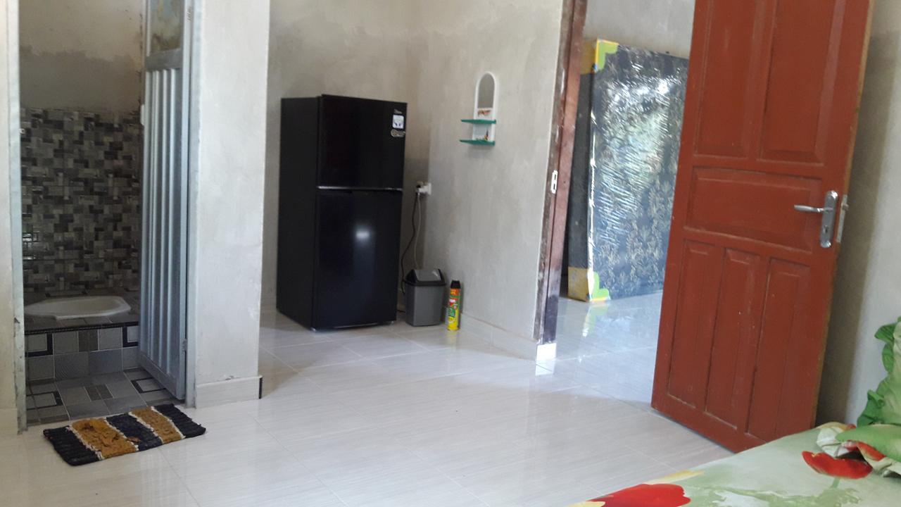 Penginapan Asidik Bira Exterior foto